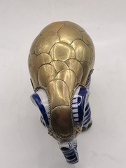 Mexican signed elephant with brass armour in white and blue ceramic. Vintage