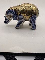 Mexican signed elephant with brass armour in white and blue ceramic. Vintage