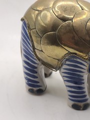 Mexican signed elephant with brass armour in white and blue ceramic. Vintage