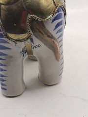 Mexican signed elephant with brass armour in white and blue ceramic. Vintage